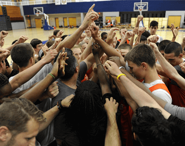 Basketball Camp Players in Huddle